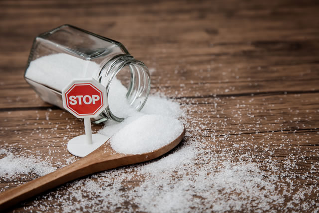 Stop sign on the sugar, warned that the sugar too much will make unhealthy nutrition, obesity, diabetes, dental care and much more.