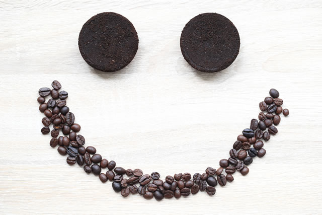 Coffee ground and Coffee beans on wooden background, Beauty and healthy care concept