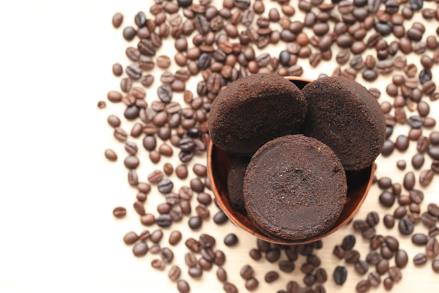 Coffee ground and Coffee beans on wooden background, Beauty and healthy care concept