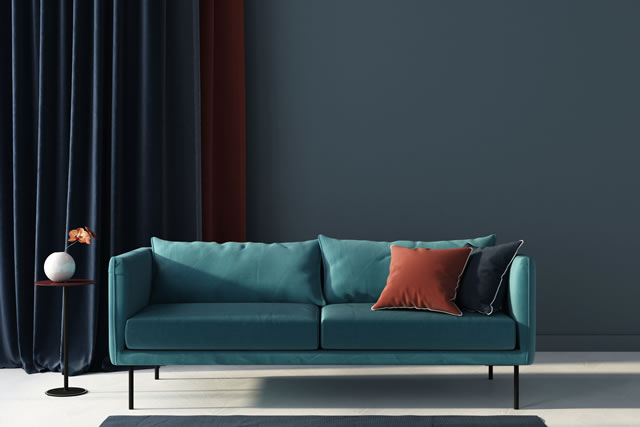 Living room in blue with terracotta pillow. 3d render