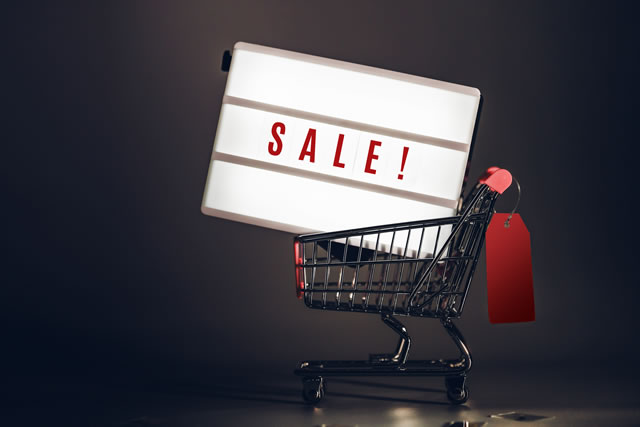 Sale light box in shopping cart with price tag at dark studio room banner size.Mock up header leave space for adding text or design for promote business campaign on line.