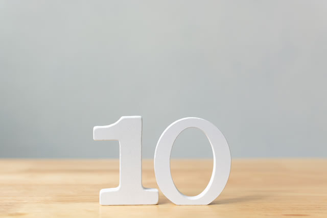 Number ten wooden material on table with copy space