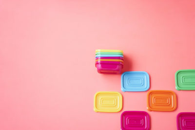 plastic container and pink background