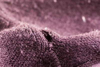 Hole on the purple sweater