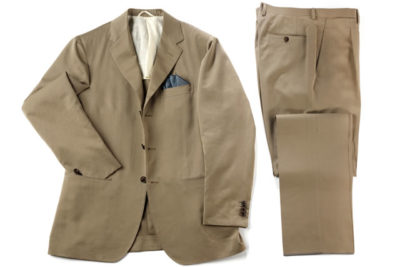 Beige suit with neatly folded pants and jacket
