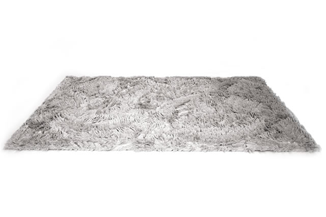 Fuzzy carpet isolated on white background. Interior element. 3d rende